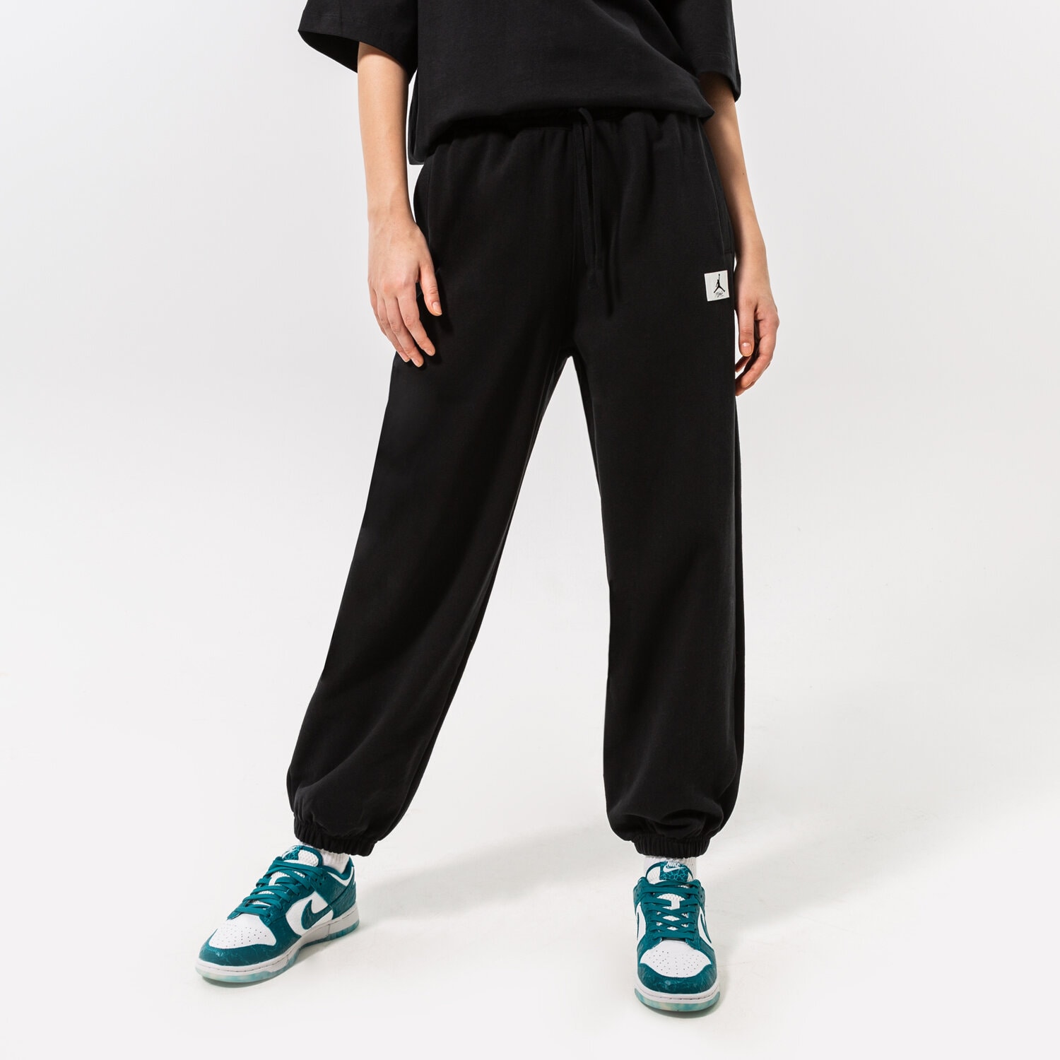 dámské kalhoty JORDAN KALHOTY  W J FLT FLC PANT DQ4607-010 ČERNÁ