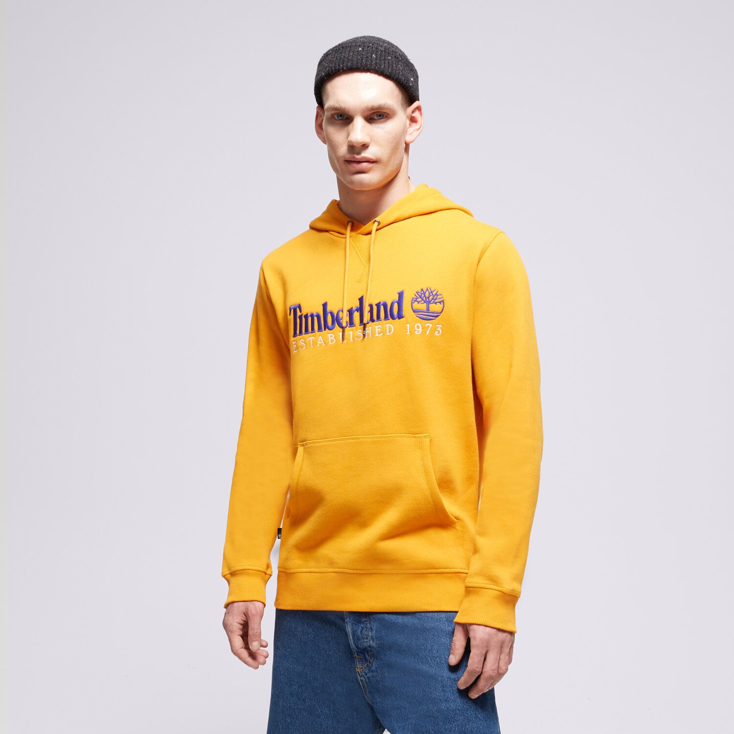 pánská mikina TIMBERLAND MIKINA S KAPUCÍ LS 50TH ANNIVERSARY EST. 1973 TB0A6S5WED11 ŽLUTÁ