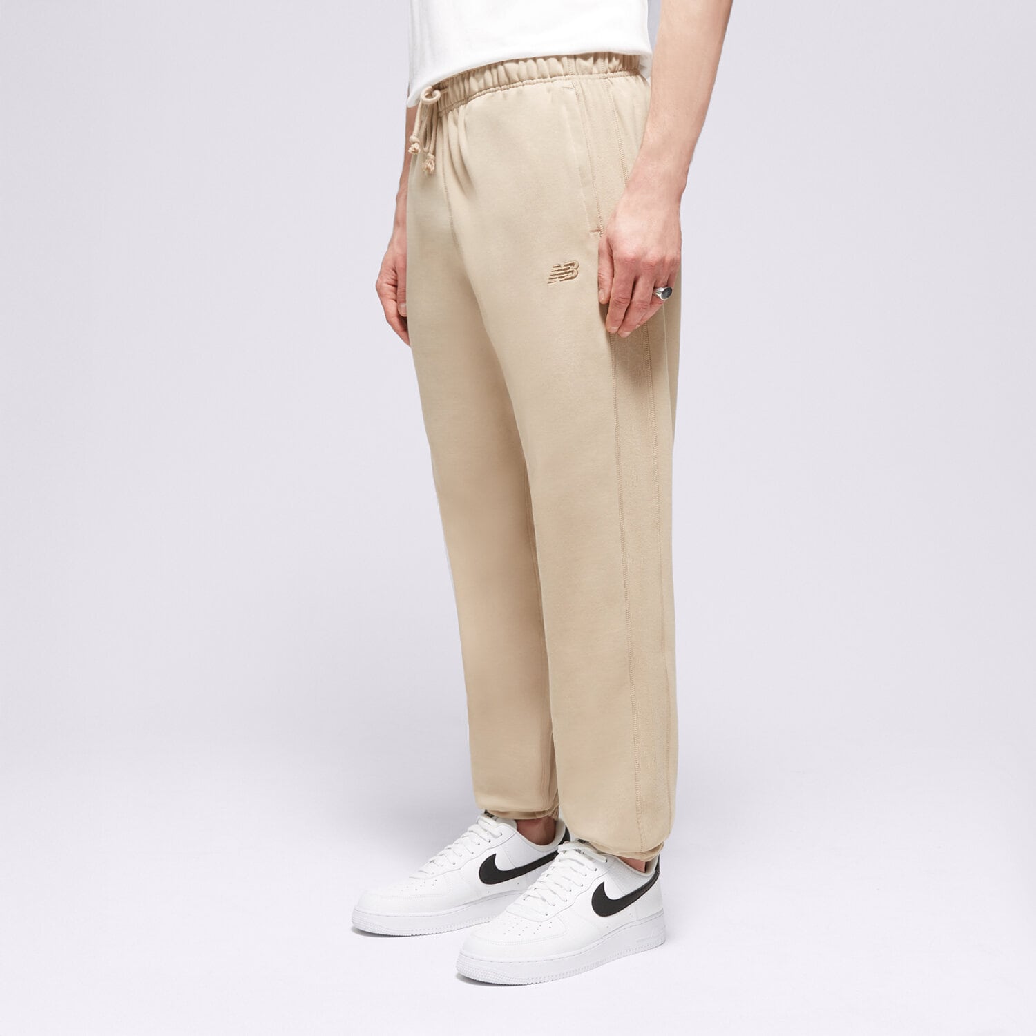 pánské kalhoty NEW BALANCE KALHOTY  ATHLETICS FRENCH TERRY JOGGER MP41508SOT BÉŽOVÁ