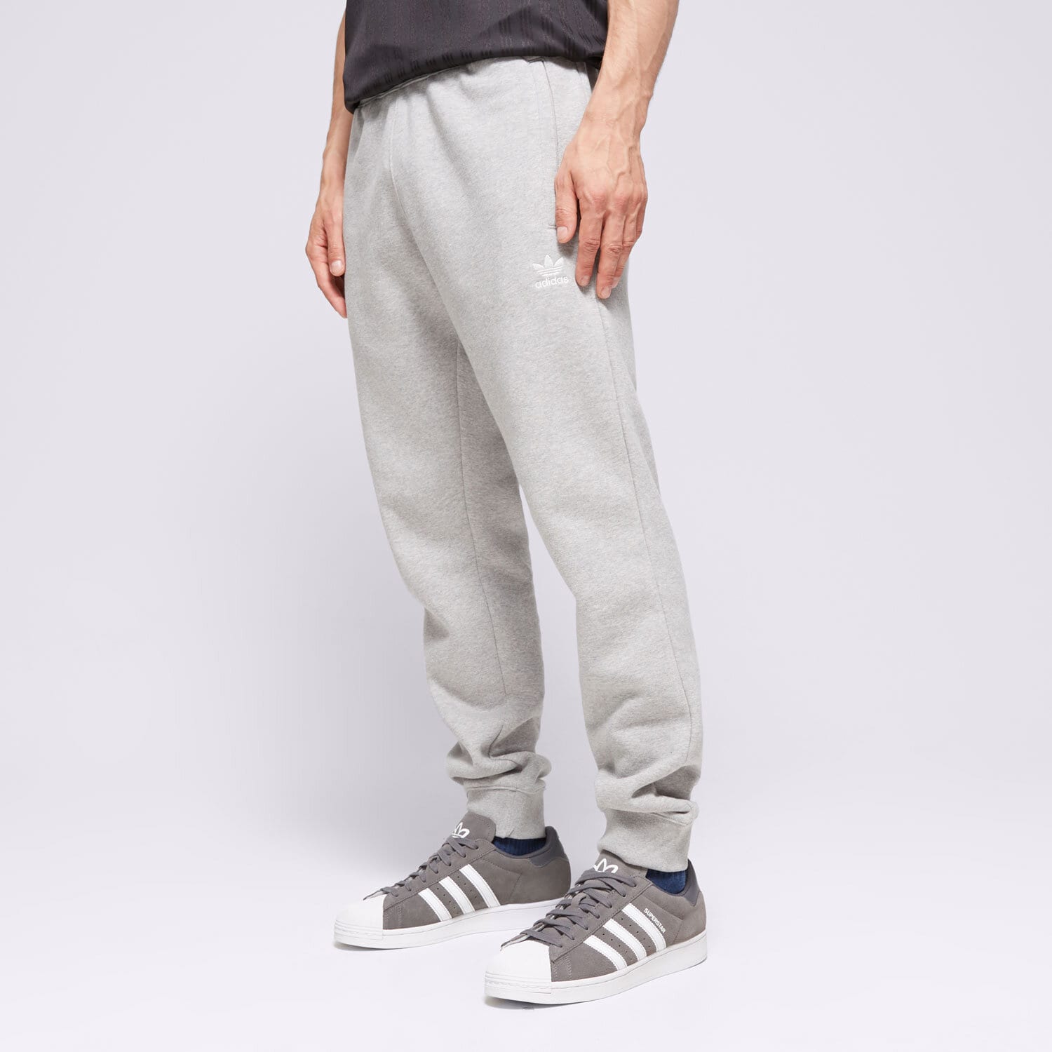 pánské kalhoty ADIDAS KALHOTY  ESSENTIALS PANT IR7803 ŠEDÁ