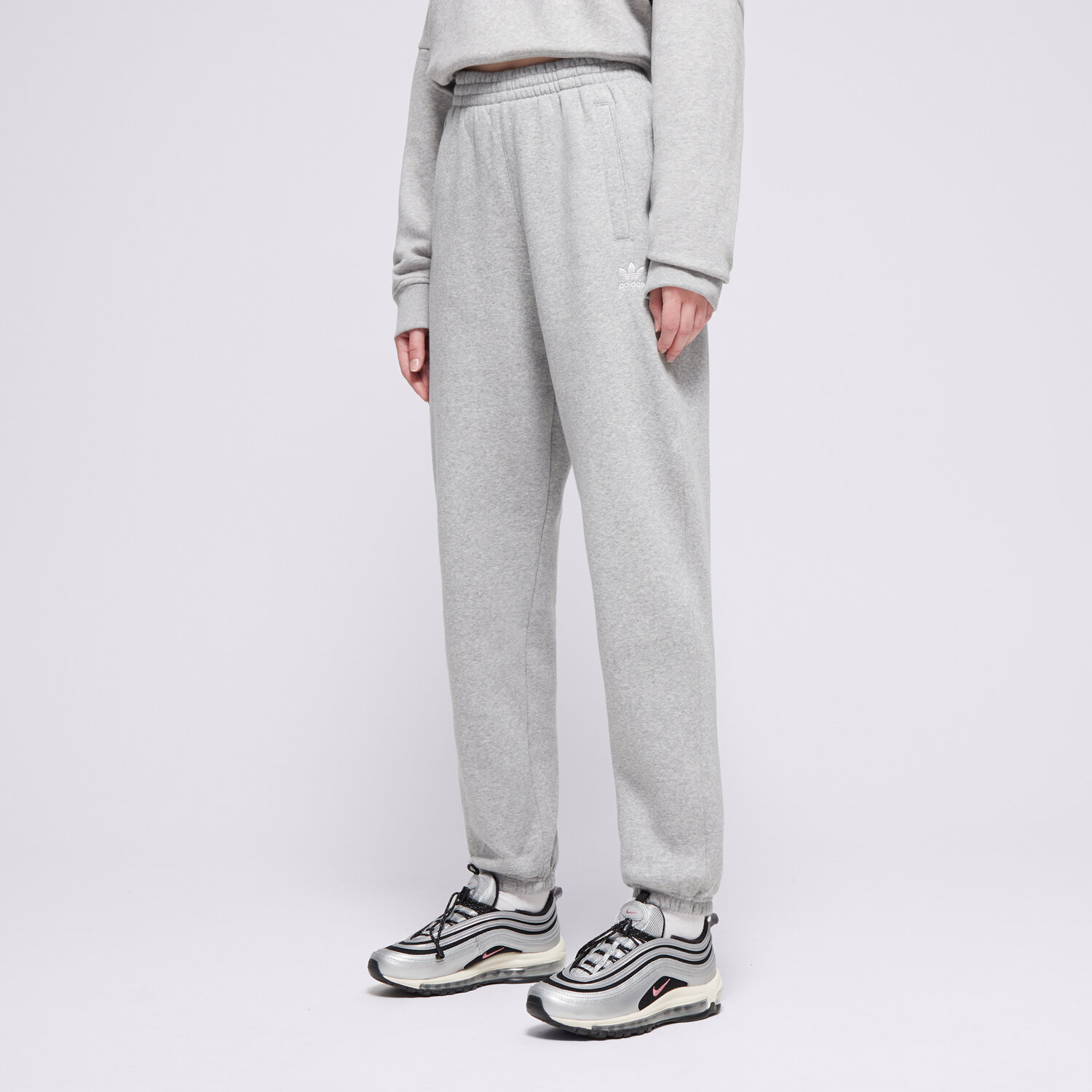 dámské kalhoty ADIDAS KALHOTY  ESS JOGGERS IY9638 ŠEDÁ