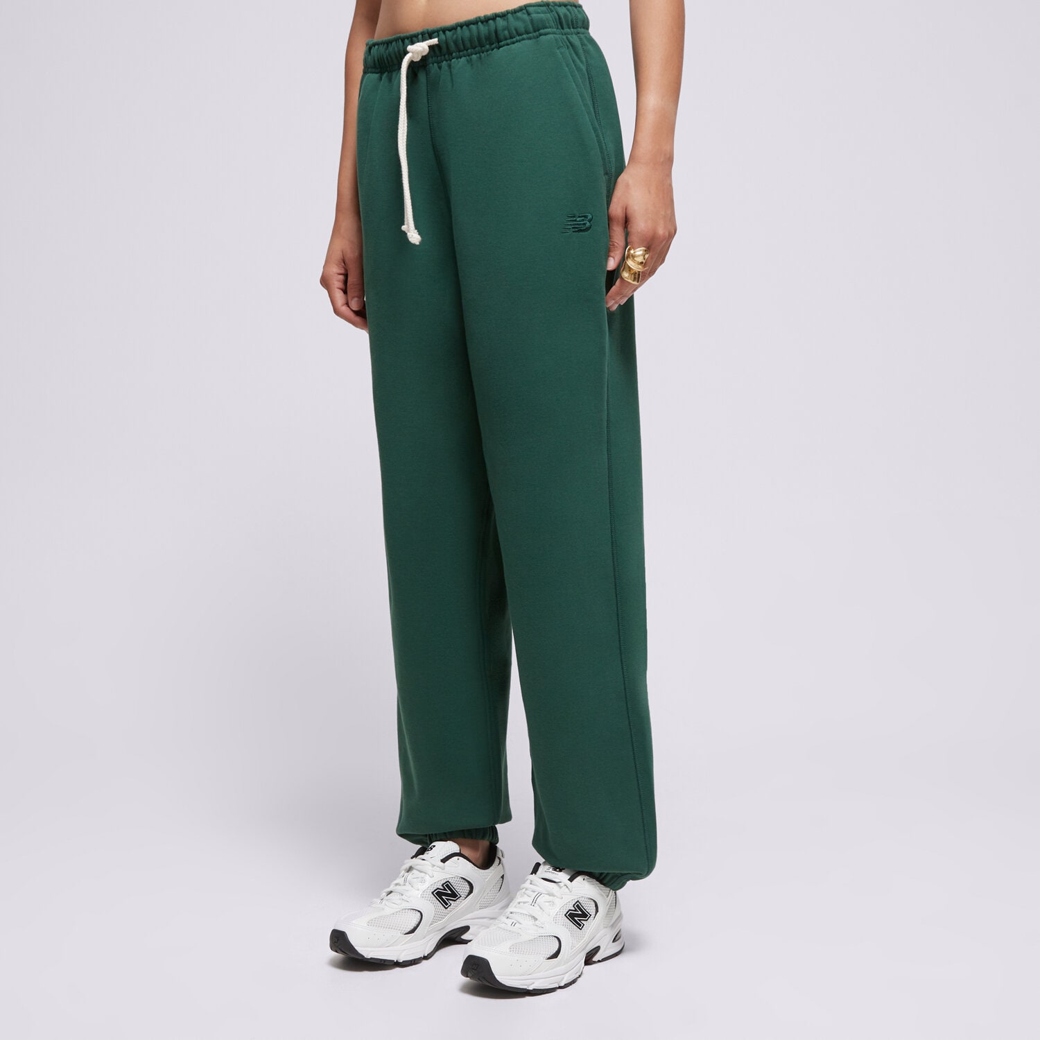dámské kalhoty NEW BALANCE KALHOTY  ATHLETICS FRENCH TERRY JOGGER WP41513NWG ZELENÁ