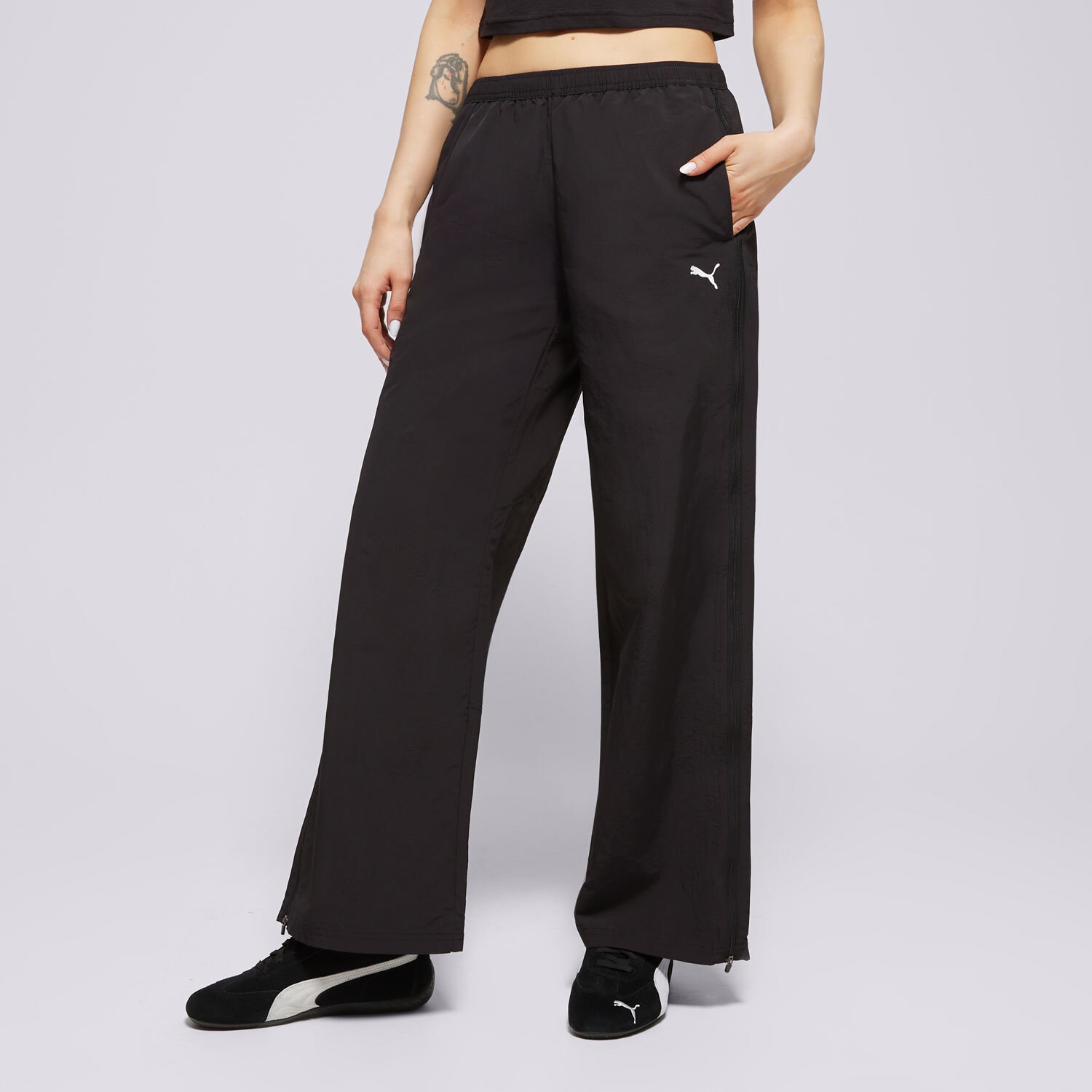 dámské kalhoty PUMA KALHOTY  RELAXED WOVEN ZIP-OFF PANTS OP 629808 01 ČERNÁ
