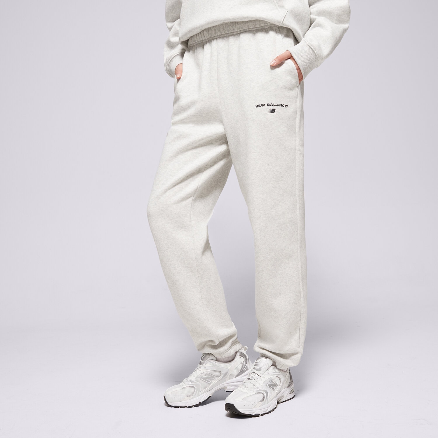 dámské kalhoty NEW BALANCE KALHOTY  REIMAGINED JOGGER WP51500AHH ŠEDÁ