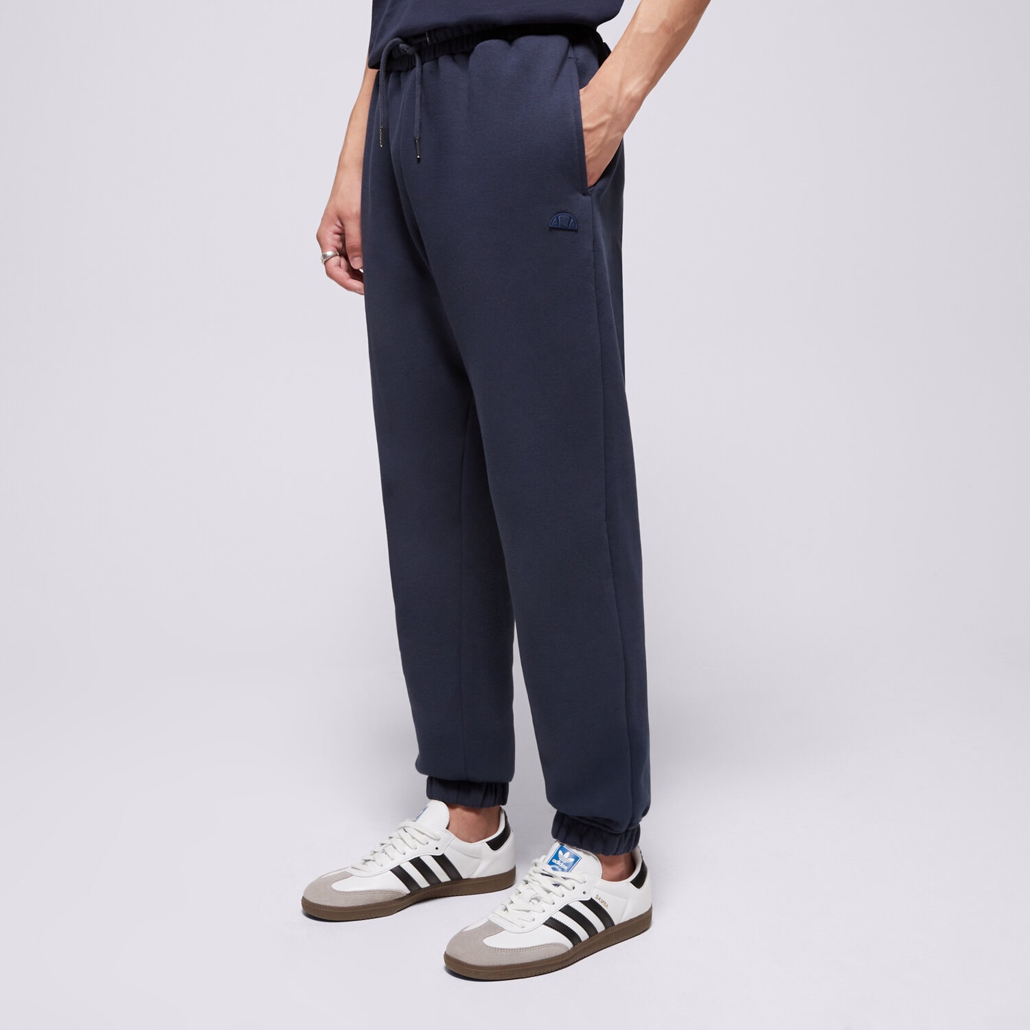 pánské kalhoty ELLESSE KALHOTY  LOMMA JOG PANT NAVY MN SMG22038481 TMAVOMODRÁ
