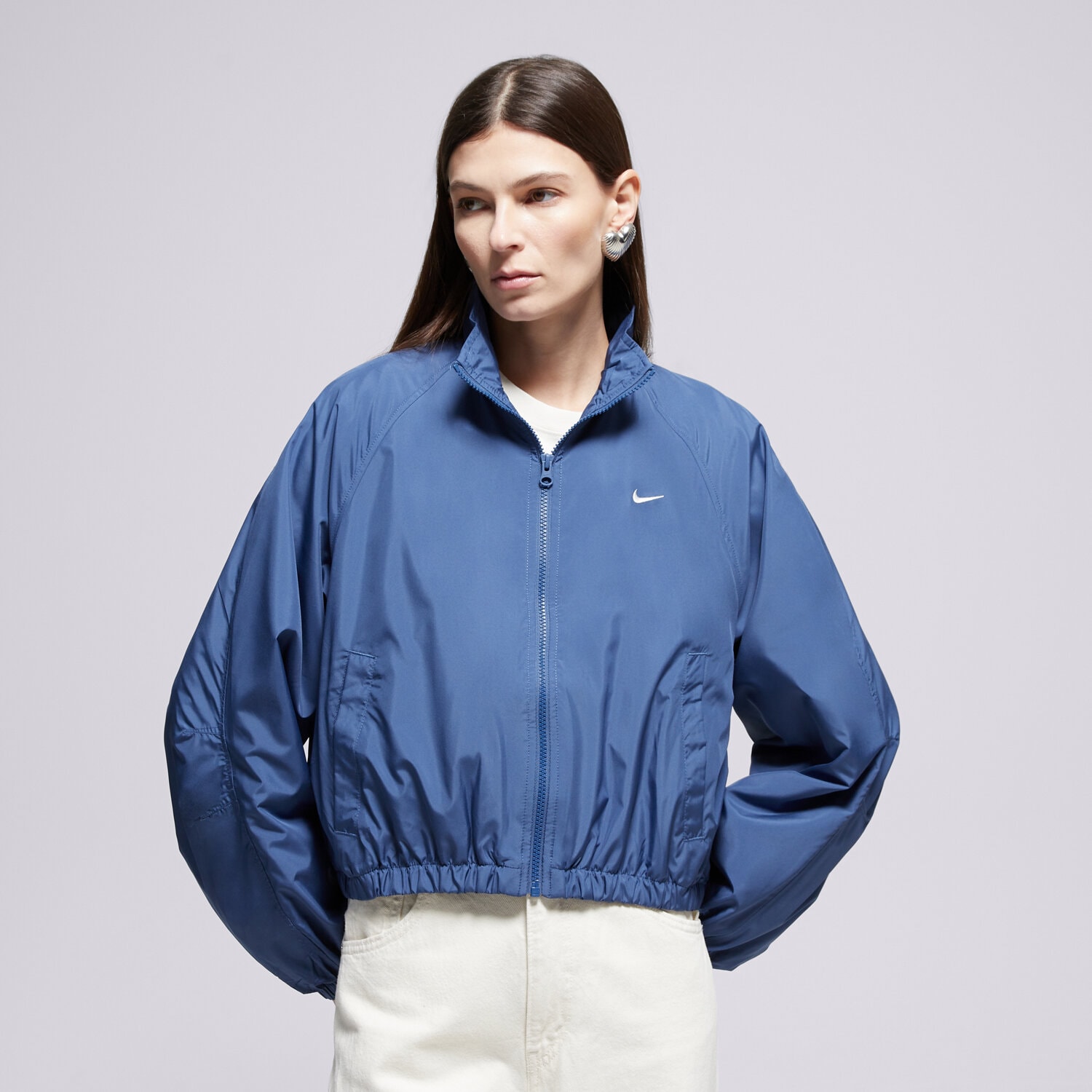 Přechodná bunda dámská (podzimní, jarní) NIKE BUNDA CLSSC UV TRACK JKT W NSW IO1473-461 MODRÁ
