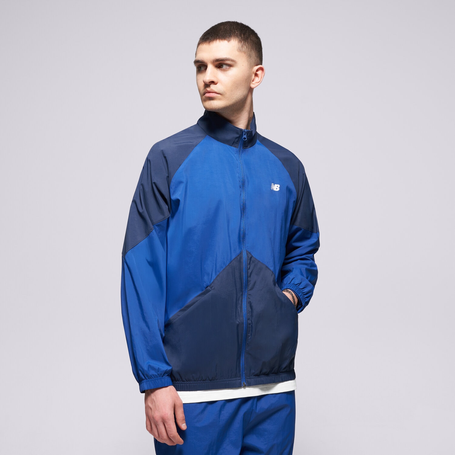 Přechodná bunda pánská (podzimní, jarní) NEW BALANCE BUNDA ORTALION SPORT LEGACY JACKET MJ61J73YNNY TMAVOMODRÁ
