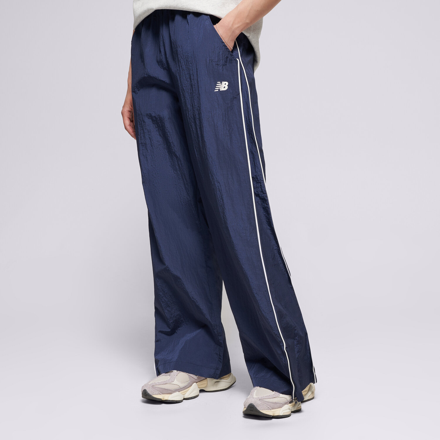dámské kalhoty NEW BALANCE KALHOTY  SPORT LEGACY PANT WB61Z1E6NNY TMAVOMODRÁ