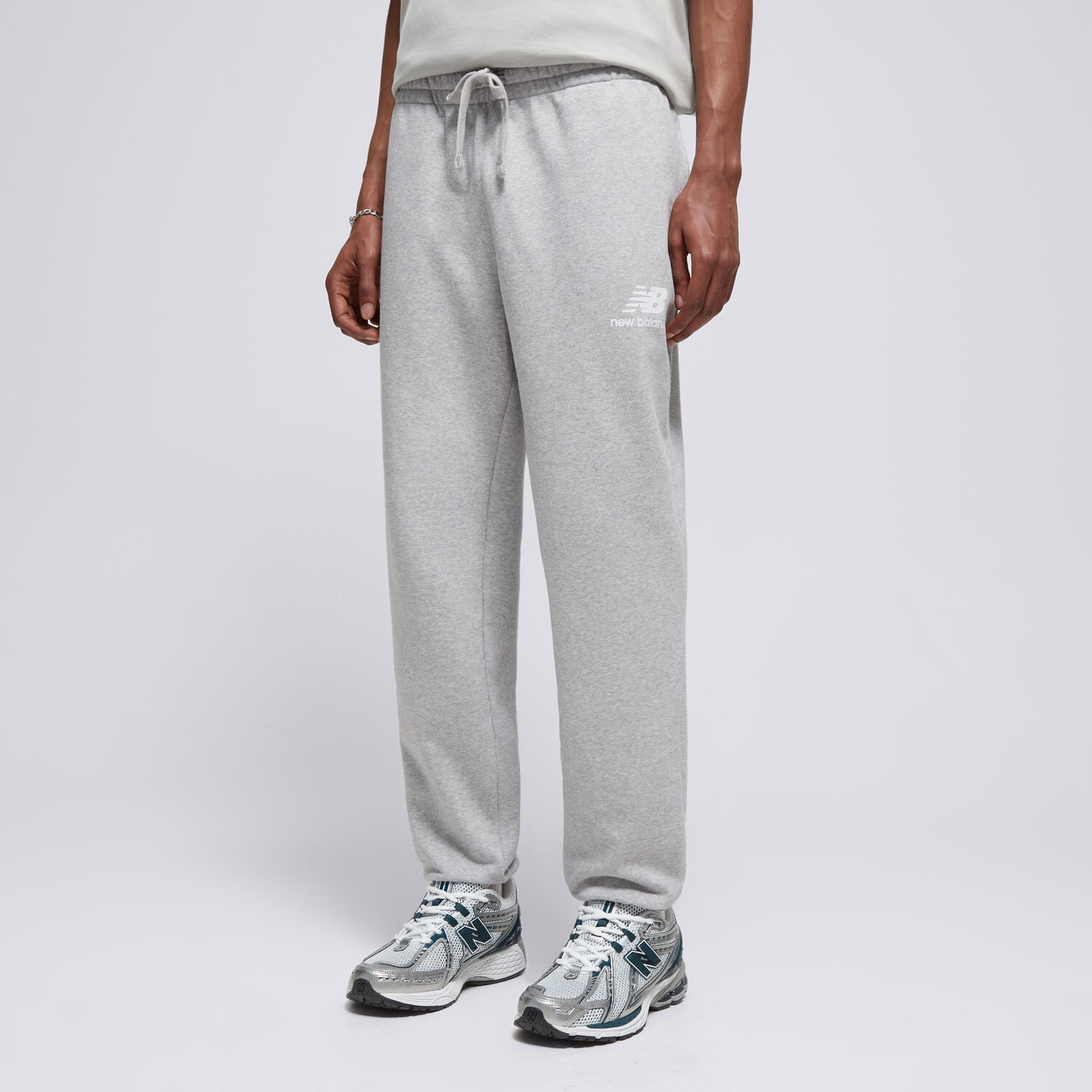 pánské kalhoty NEW BALANCE KALHOTY  NB ESSENTIAL STACKED MP31539AG ŠEDÁ