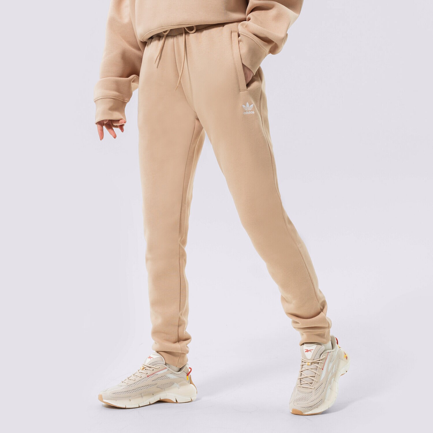 dámské kalhoty ADIDAS ESSENTIAL SLIM JOGGERS  HJ7850 BÉŽOVÁ