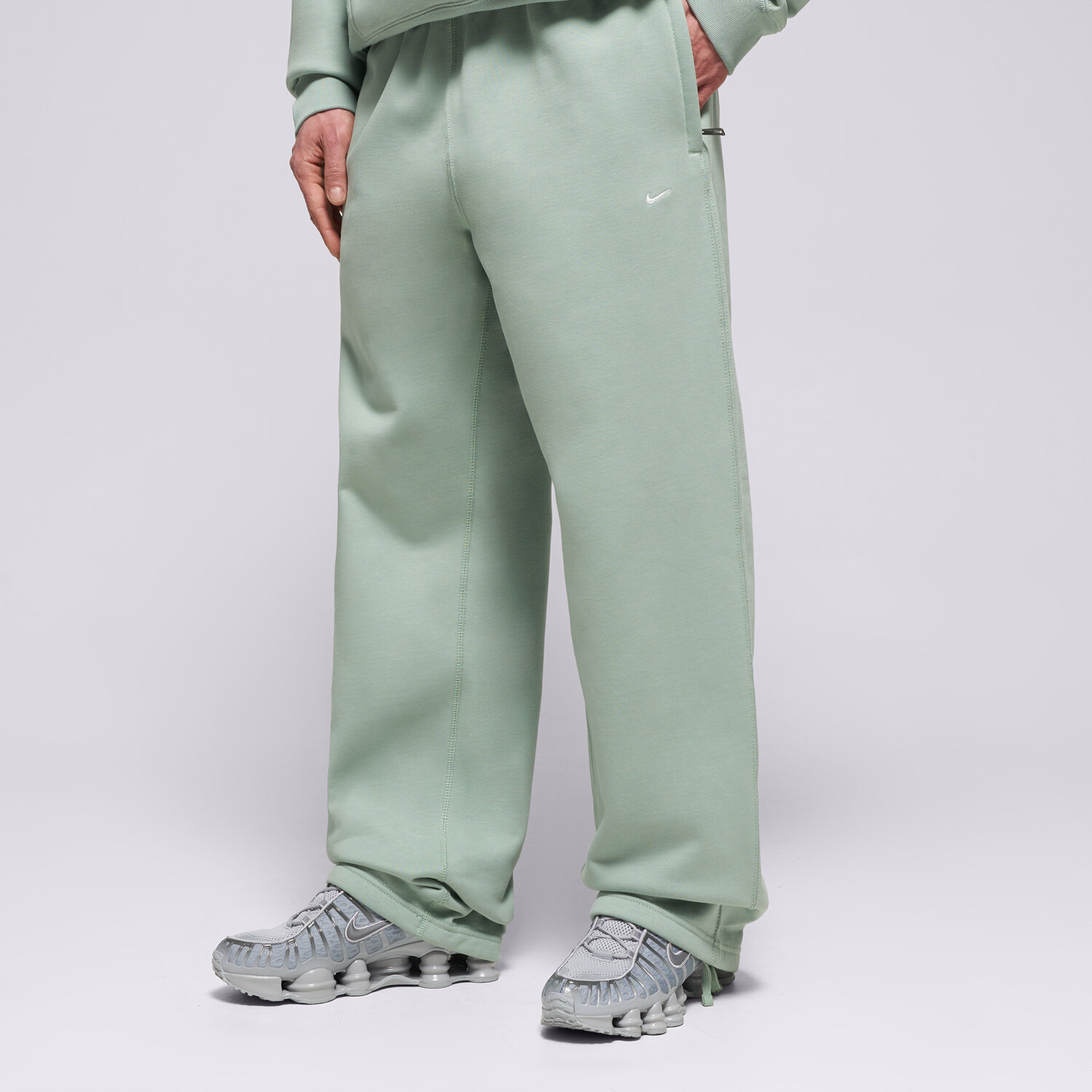 pánské kalhoty NIKE KALHOTY  M NL SOLO SWSH BB OH PANT HV1090-006 ZELENÁ