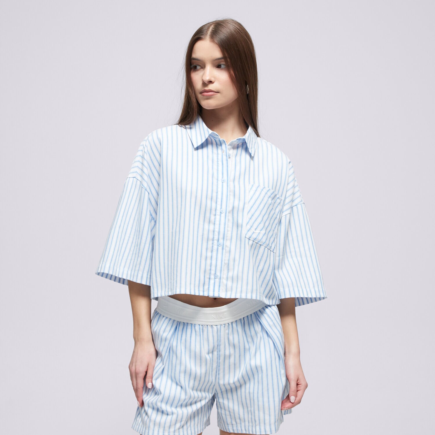 dámské tričko NIKE KOŠILE W NSW OFFLN WVN PPLN STRP SS II4228-435 MODRÁ