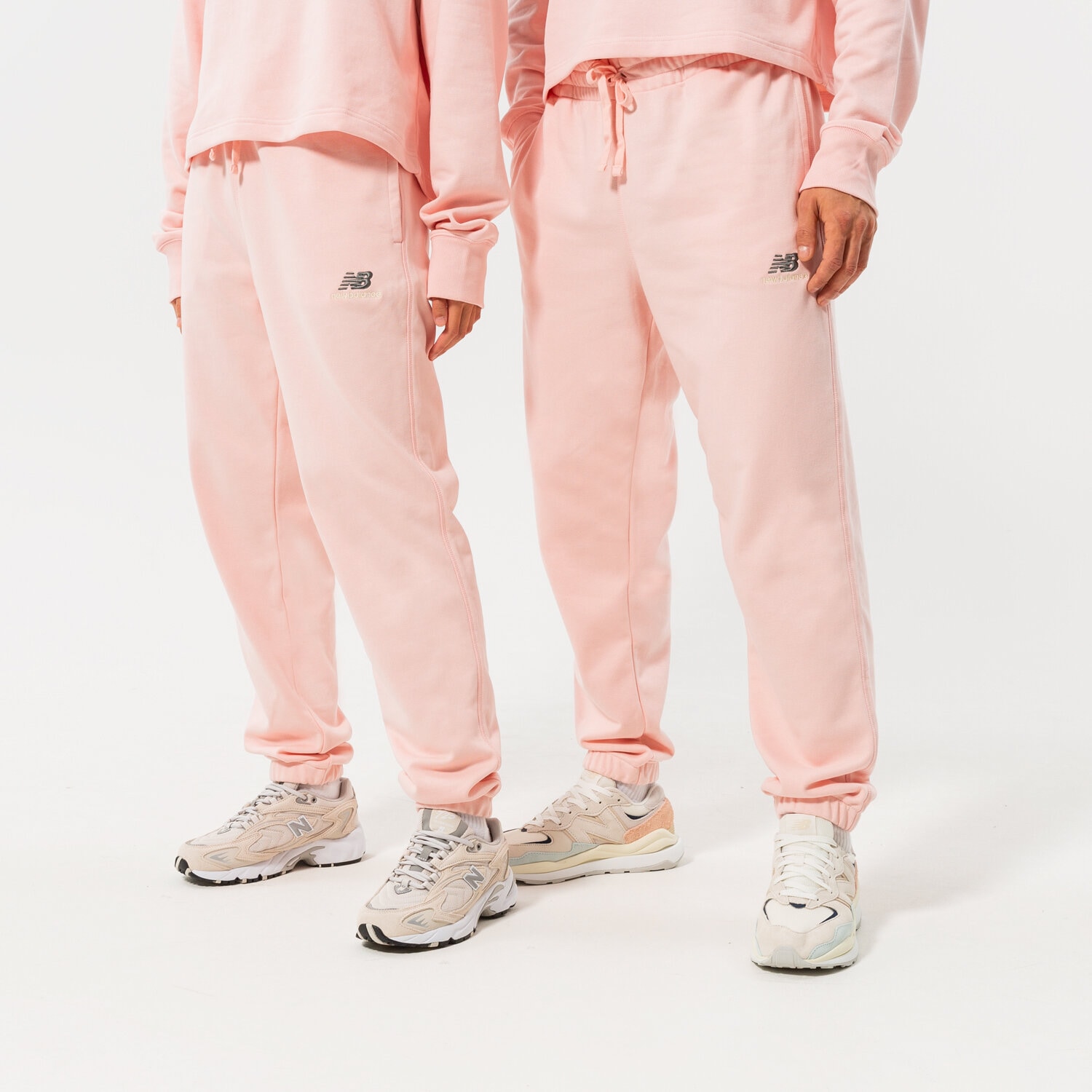 dámské kalhoty NEW BALANCE KALHOTY  NB ESSENTIALS UNI-SSENTIALS SWEATPANT UP21500PIE RŮŽOVÁ