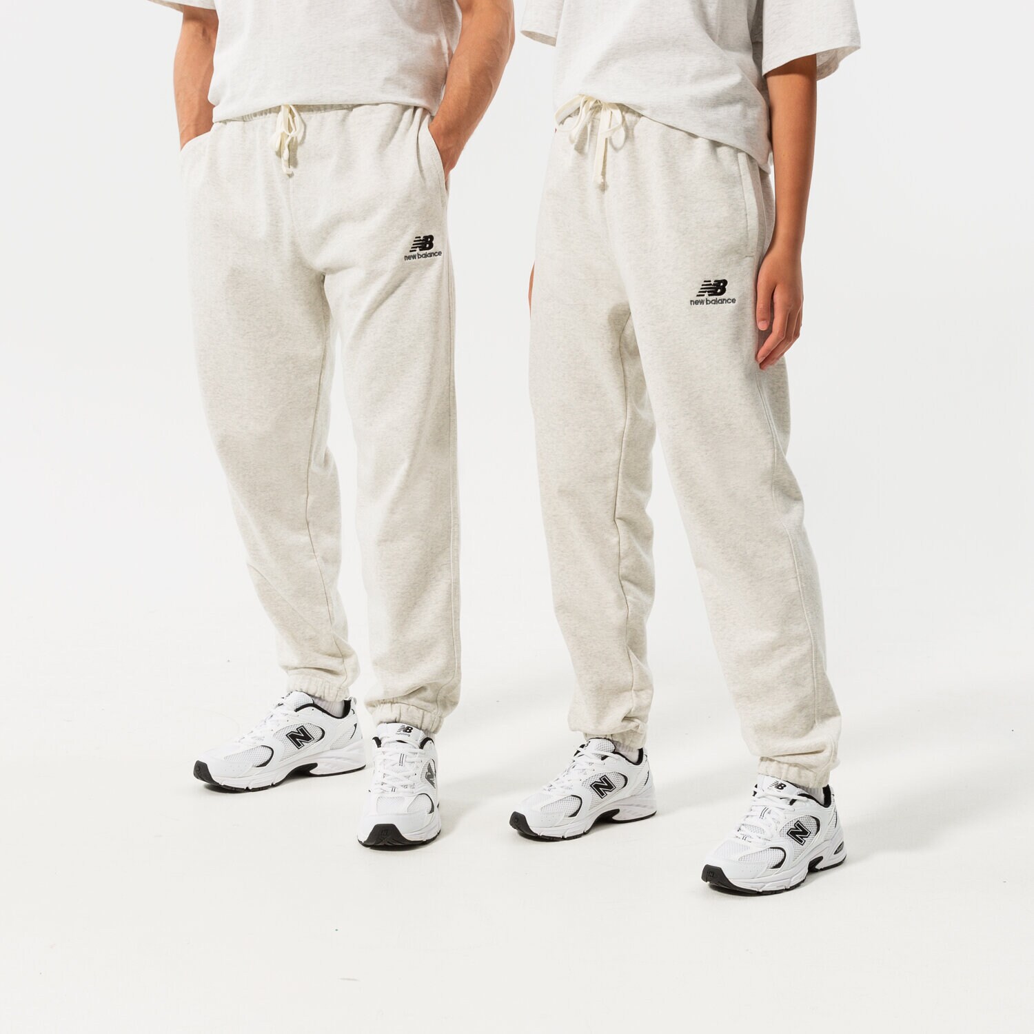 dámské kalhoty NEW BALANCE KALHOTY  NB ESSENTIALS UNI-SSENTIALS SWEATPANT UP21500SAH ŠEDÁ