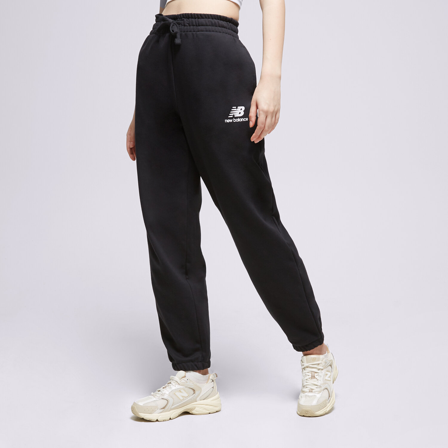 dámské kalhoty NEW BALANCE KALHOTY  NB ESSENTIALS STACKET WP31530BK ČERNÁ