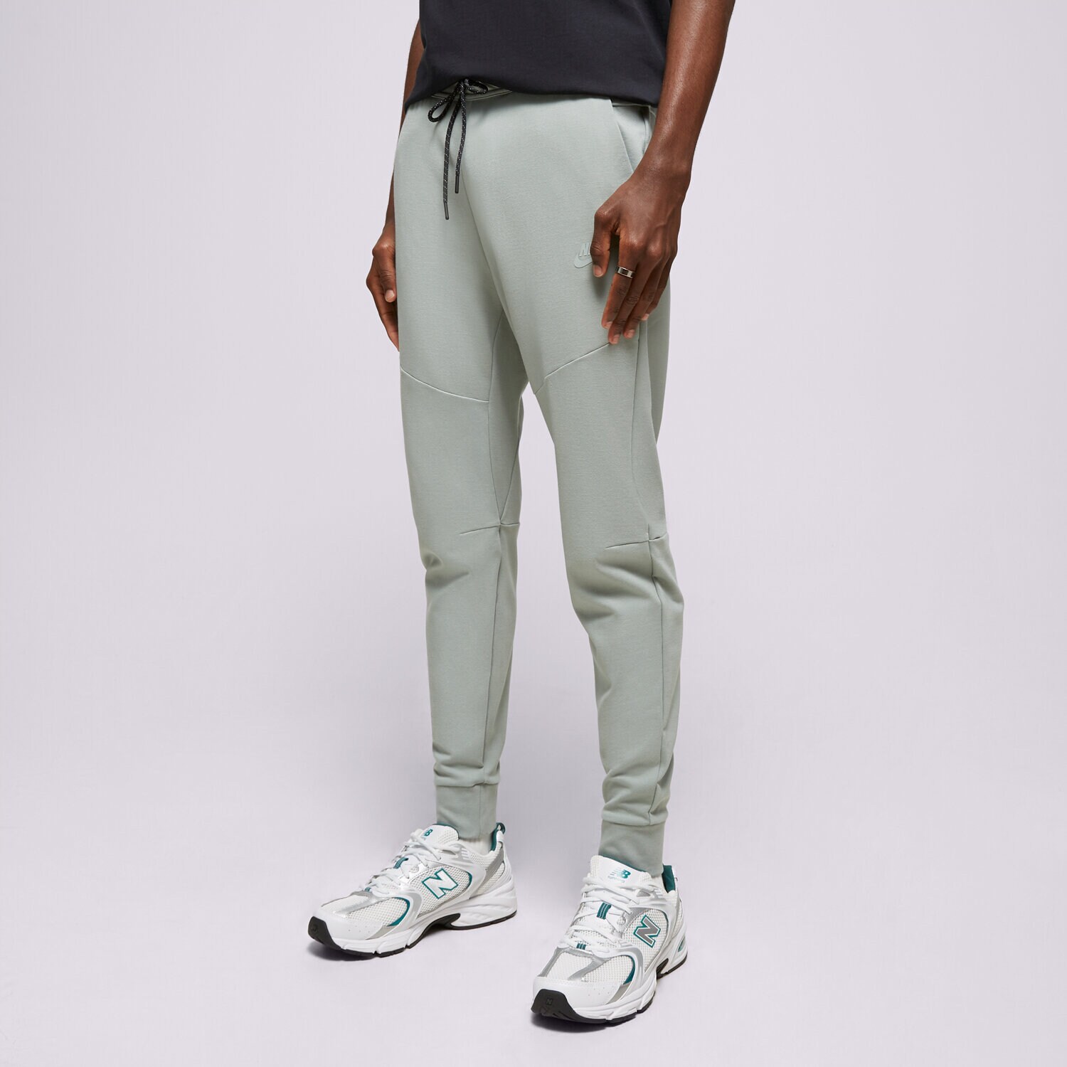 pánské kalhoty NIKE KALHOTY  M NK TECH LGHTWHT JGGR DX0826-330 ZELENÁ