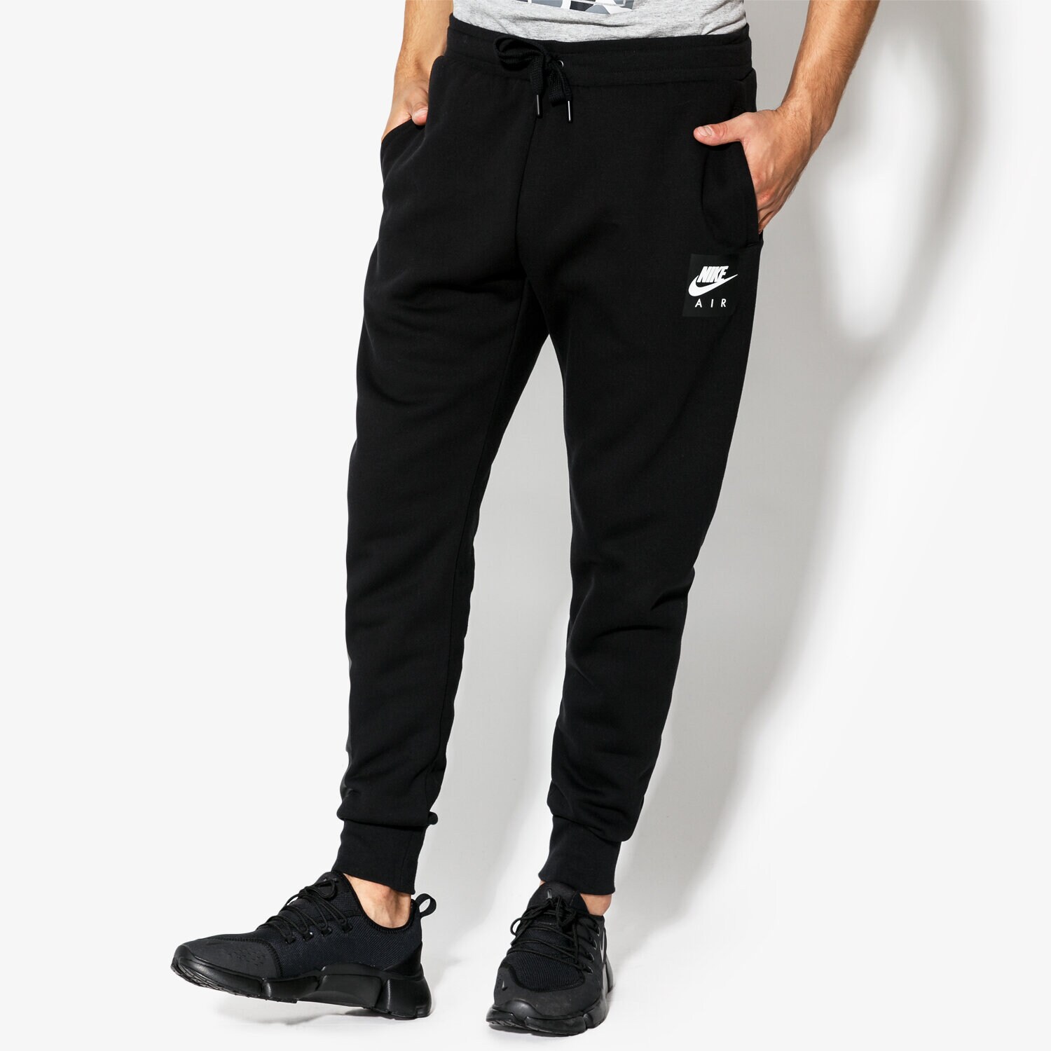 pánské kalhoty NIKE KALHOTY  M NSW PANT FLC NIKE AIR 928637-010 ČERNÁ