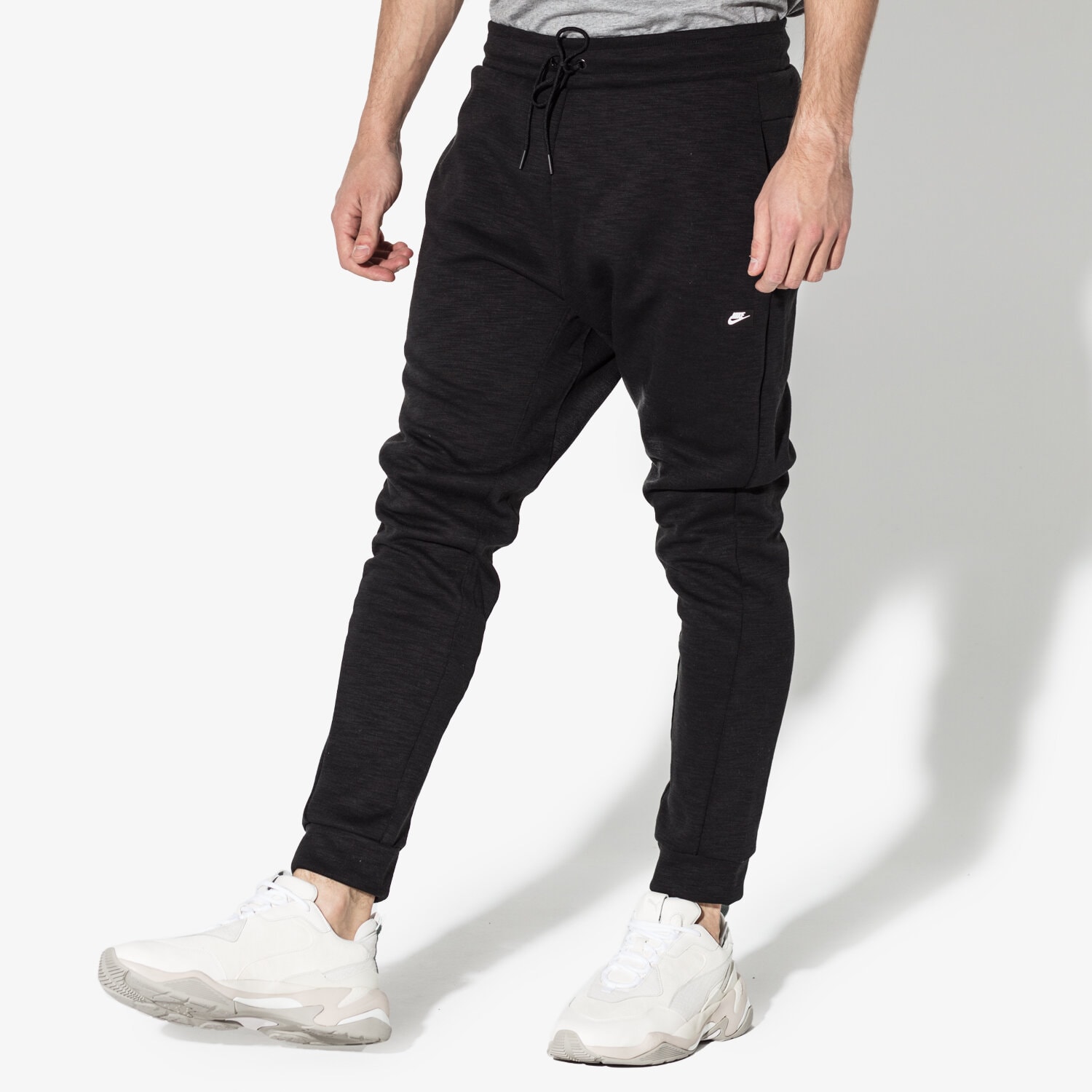 pánské kalhoty NIKE KALHOTY  M NSW OPTIC JGGR 928493-011 ČERNÁ