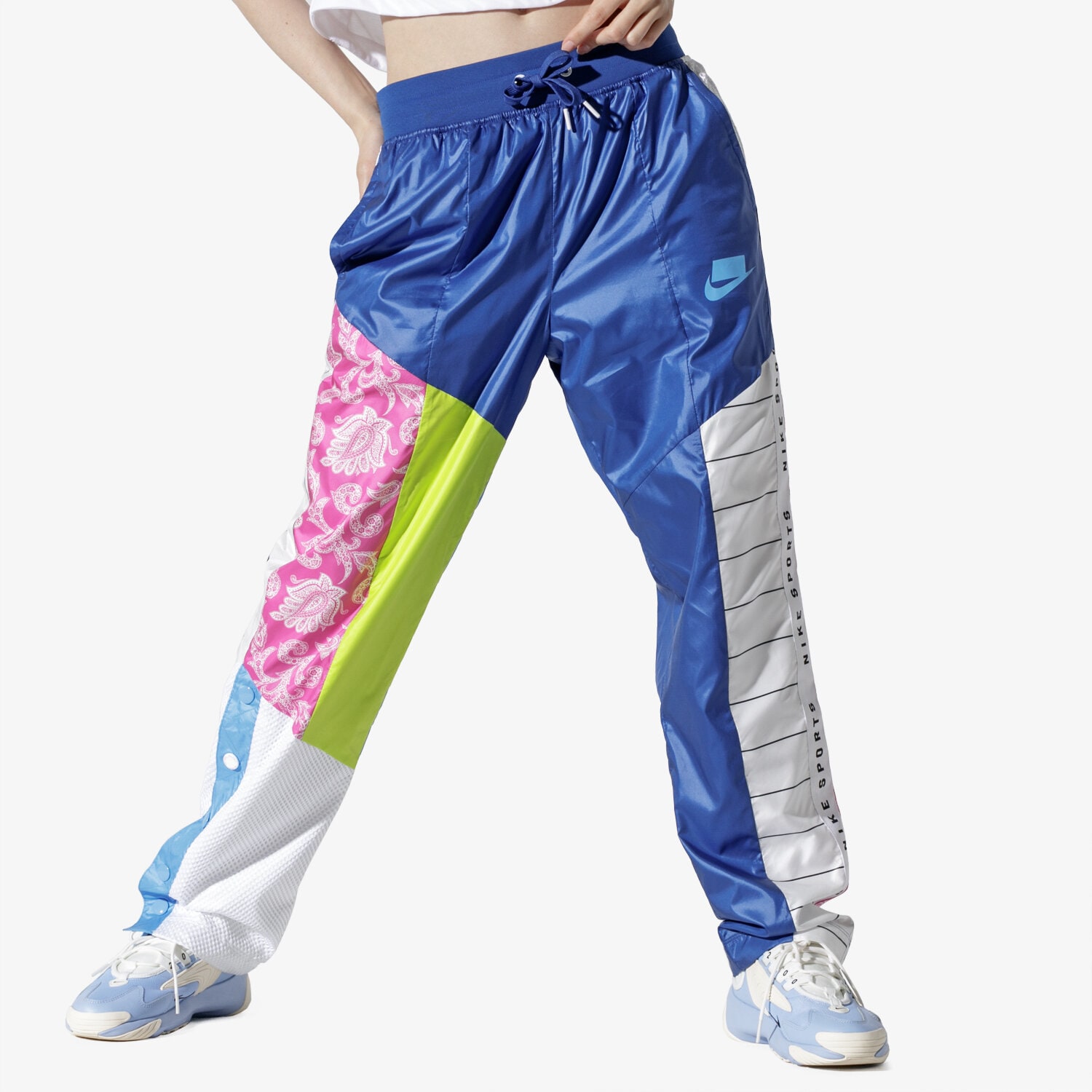dámské kalhoty NIKE W NSW NSP TRK PANT WVN  AR2940-438 VÍCEBAREVNÁ