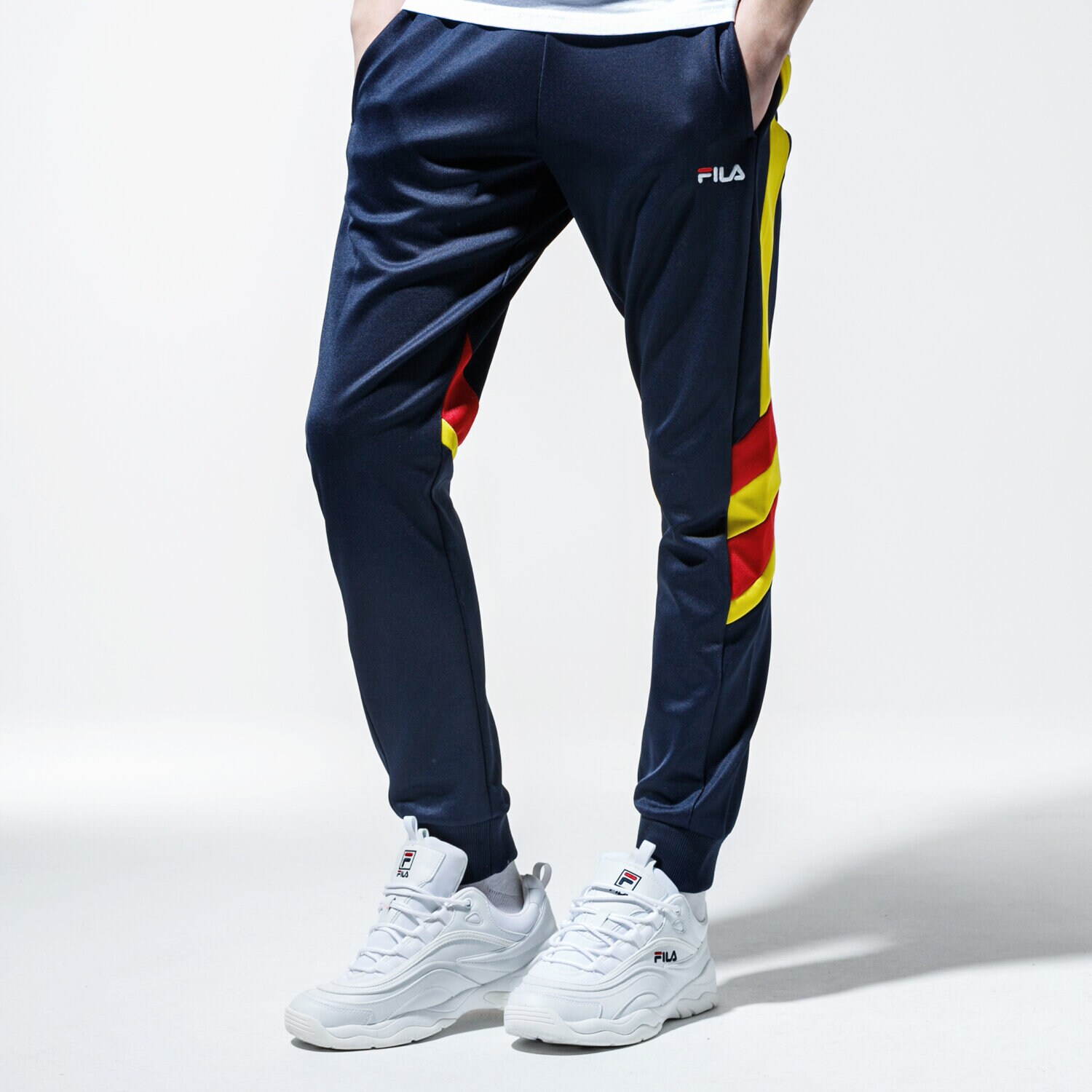pánské kalhoty FILA KALHOTY  NERITAN TRACK PANTS 687240A465 TMAVOMODRÁ