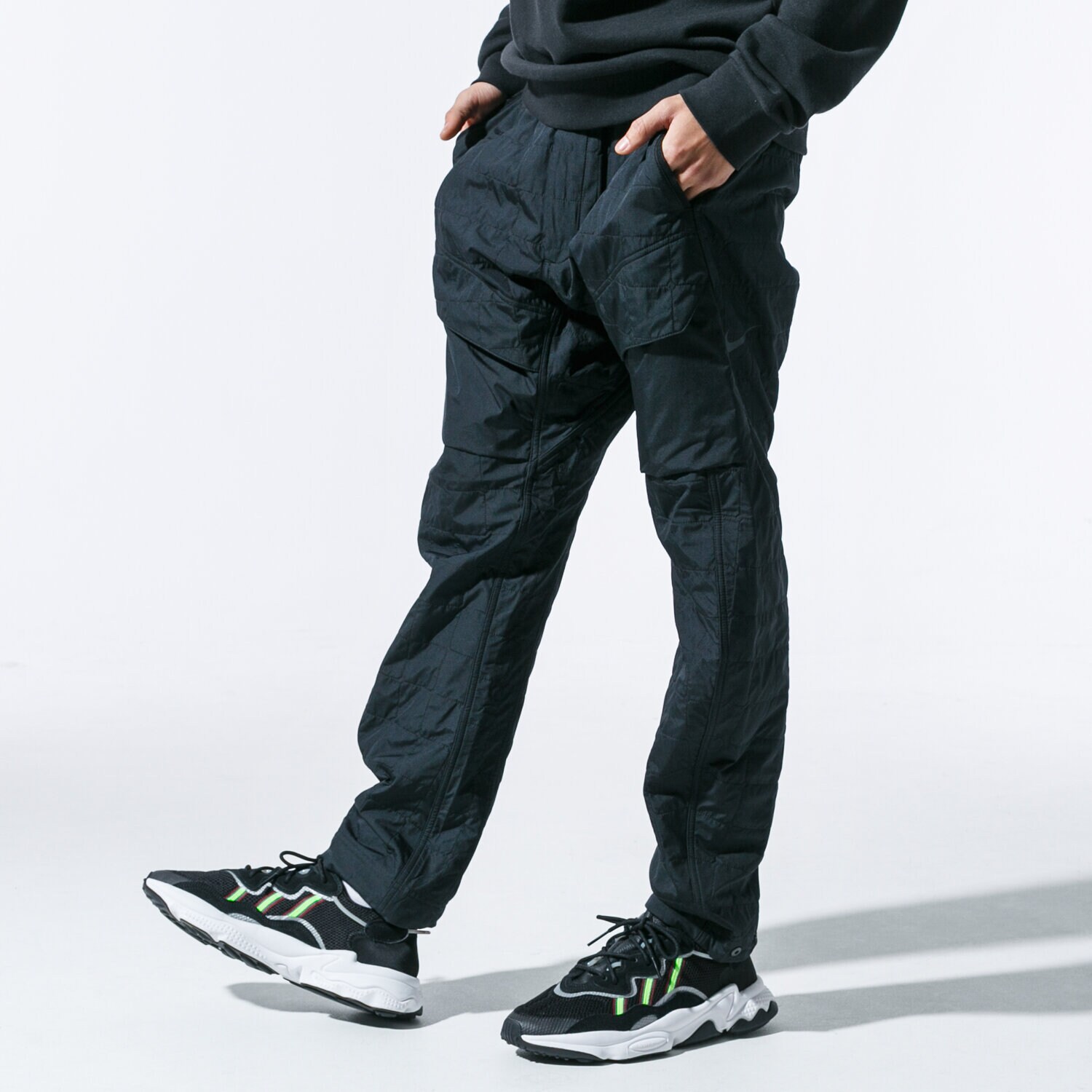 pánské kalhoty NIKE KALHOTY  M NSW TCH PCK PANT WVN QLTD BV4639-010 ČERNÁ