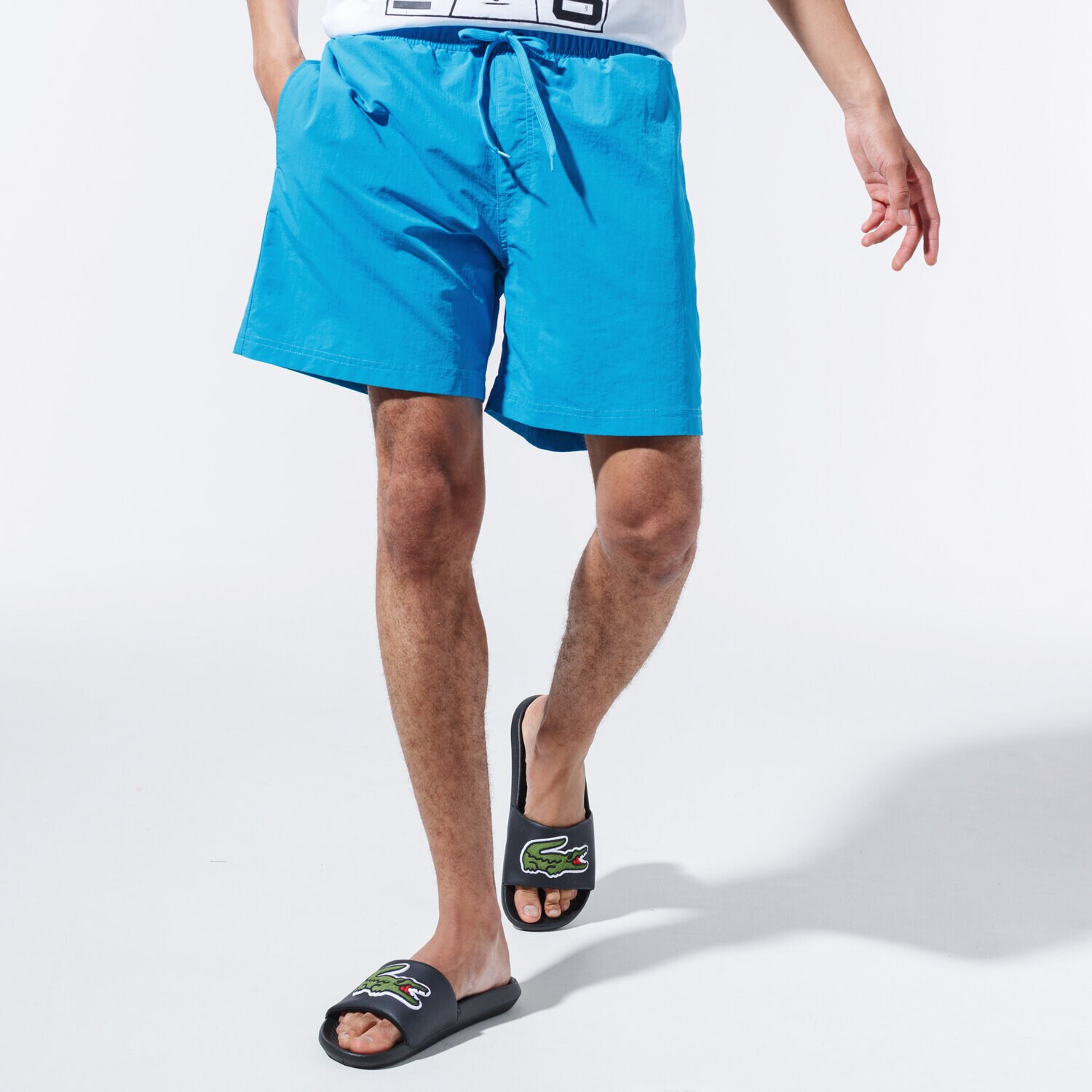 pánské kraťasy CHAMPION ŠORTKY  BASIC SWIM SHORTS 215498BS030 MODRÁ