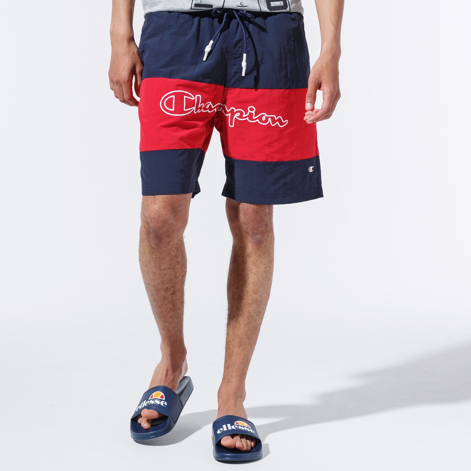 pánské kraťasy CHAMPION ŠORTKY  LOGO SWIM SHORTS 215499BS501 TMAVOMODRÁ
