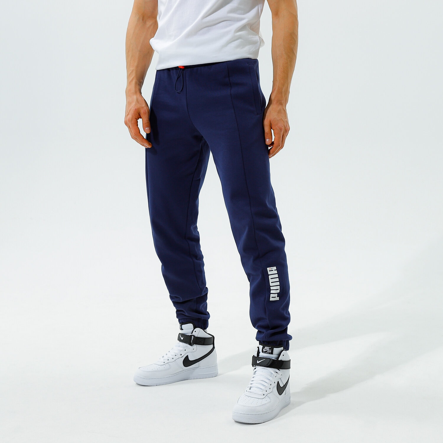 pánské kalhoty PUMA KALHOTY  RAD/CAL PANTS DK CL - PEACOAT 58939006 TMAVOMODRÁ