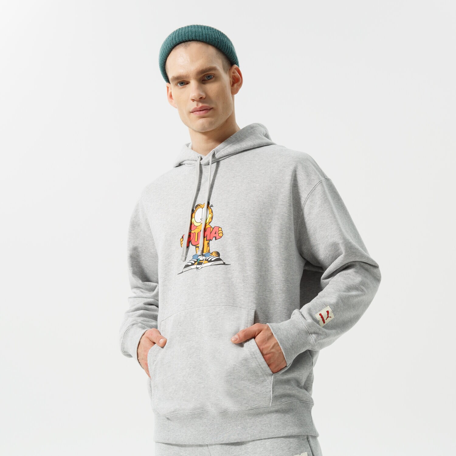 pánská mikina PUMA MIKINA S KAPUCÍ PUMA X GARFIELD HOODIE 534435 04 ŠEDÁ