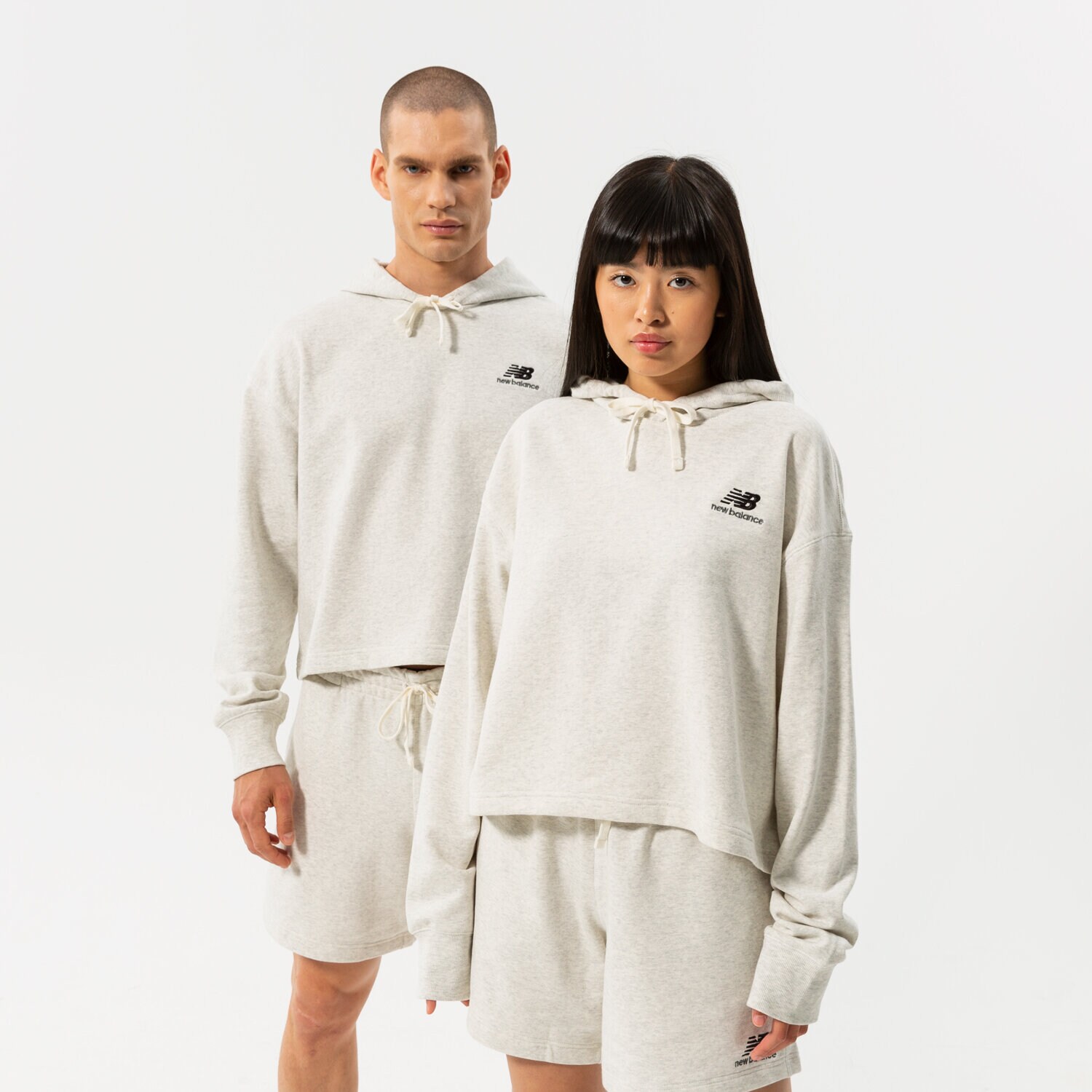 dámská mikina NEW BALANCE MIKINA S KAPUCÍ NB ESSENTIALS UNI-SSENTIALS CROP UT21502SAH ŠEDÁ