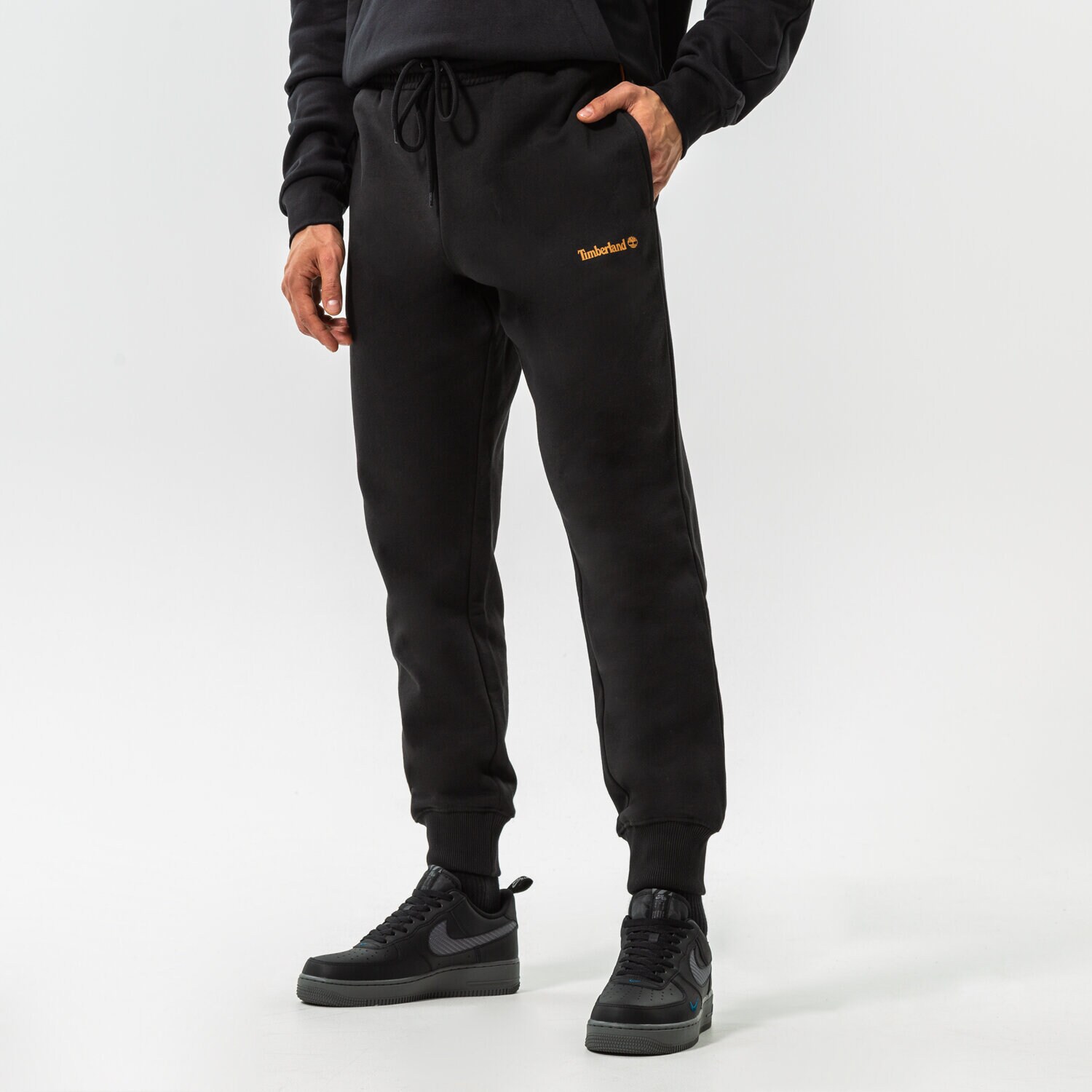 pánské kalhoty TIMBERLAND KALHOTY  EPP - SMALL LOGO PRINT SWEATPANT TB0A5PF40011 ČERNÁ