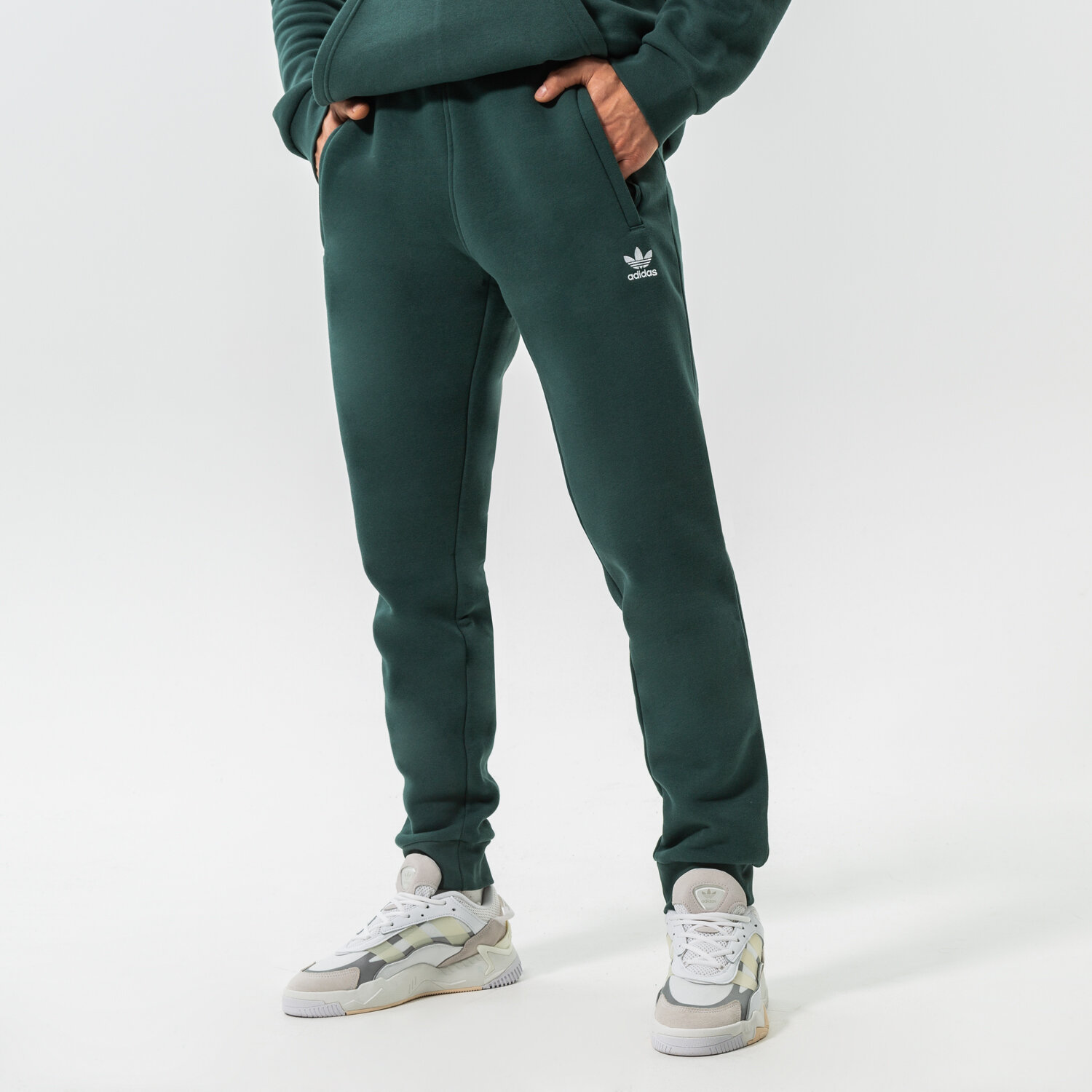 pánské kalhoty ADIDAS KALHOTY  ESSENTIALS PANT HK0106 ZELENÁ