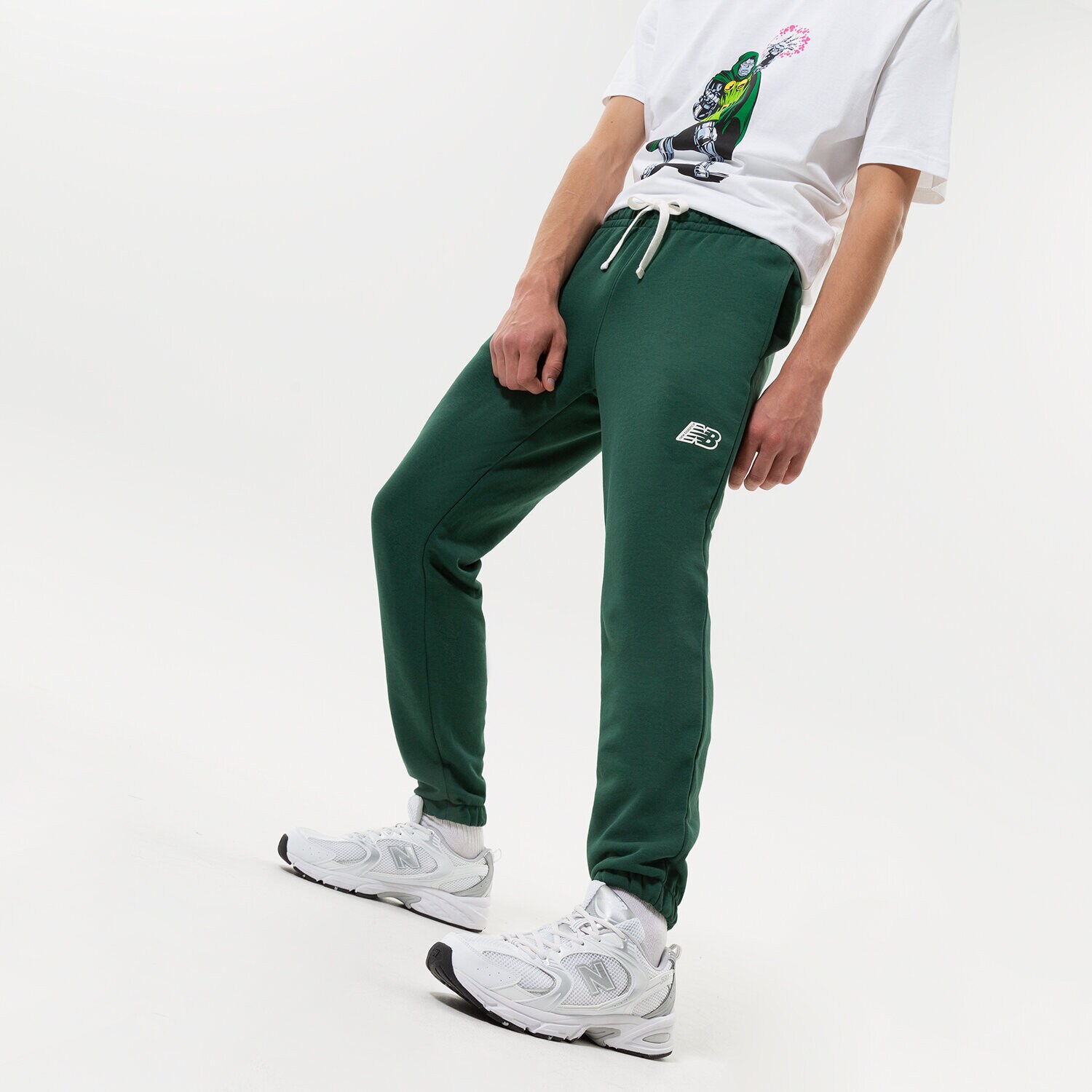 pánské kalhoty NEW BALANCE KALHOTY  NB ESSENTIALS FLEECE JOGGER MP23504NWG ZELENÁ