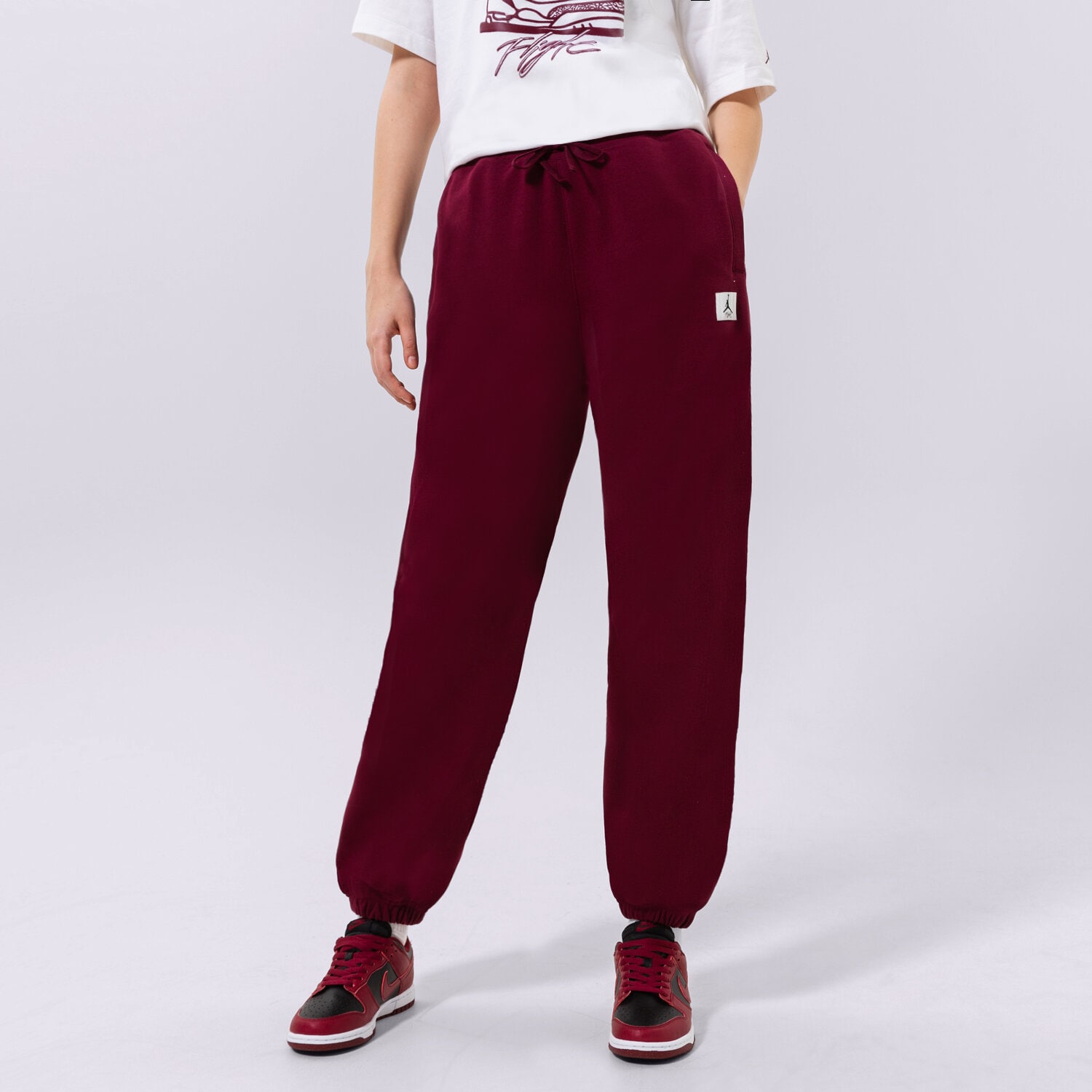 dámské kalhoty JORDAN KALHOTY  W J FLT FLC PANT DQ4607-645 BORDOVÁ