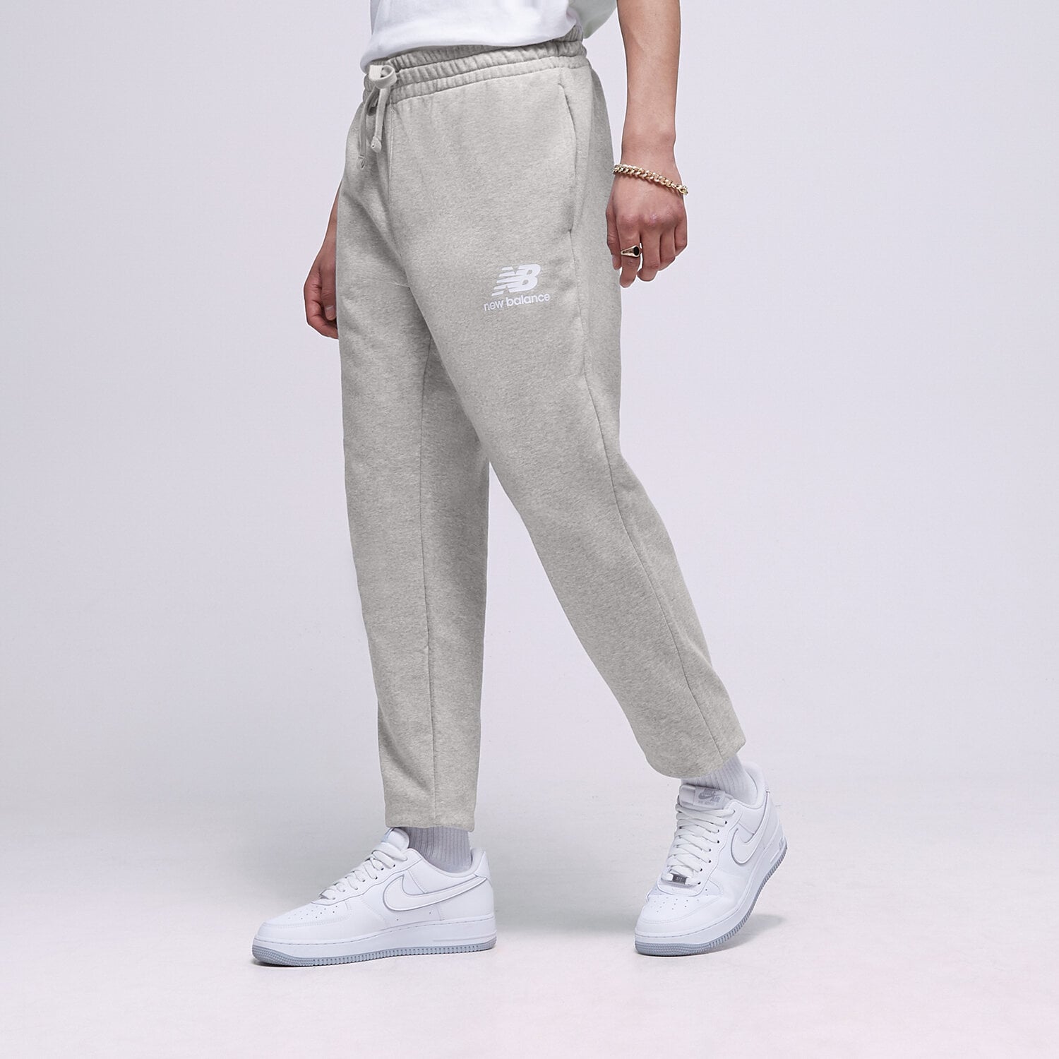 pánské kalhoty NEW BALANCE KALHOTY  NB ESSENTIAL STACKED MP31539AG ŠEDÁ