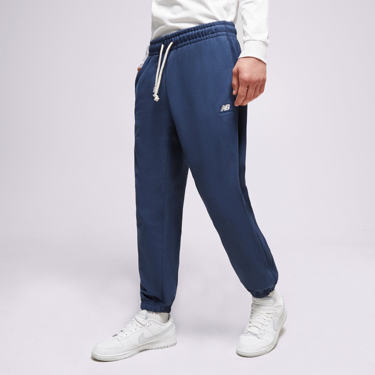 pánské kalhoty NEW BALANCE KALHOTY  ATHLETICS REMASTERED FRENCH MP31503NNY TMAVOMODRÁ