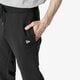 pánské kalhoty NEW ERA KALHOTY  NE ESSENTIAL JOGGER BLK NEW ERA BLK 11860049 barva černá